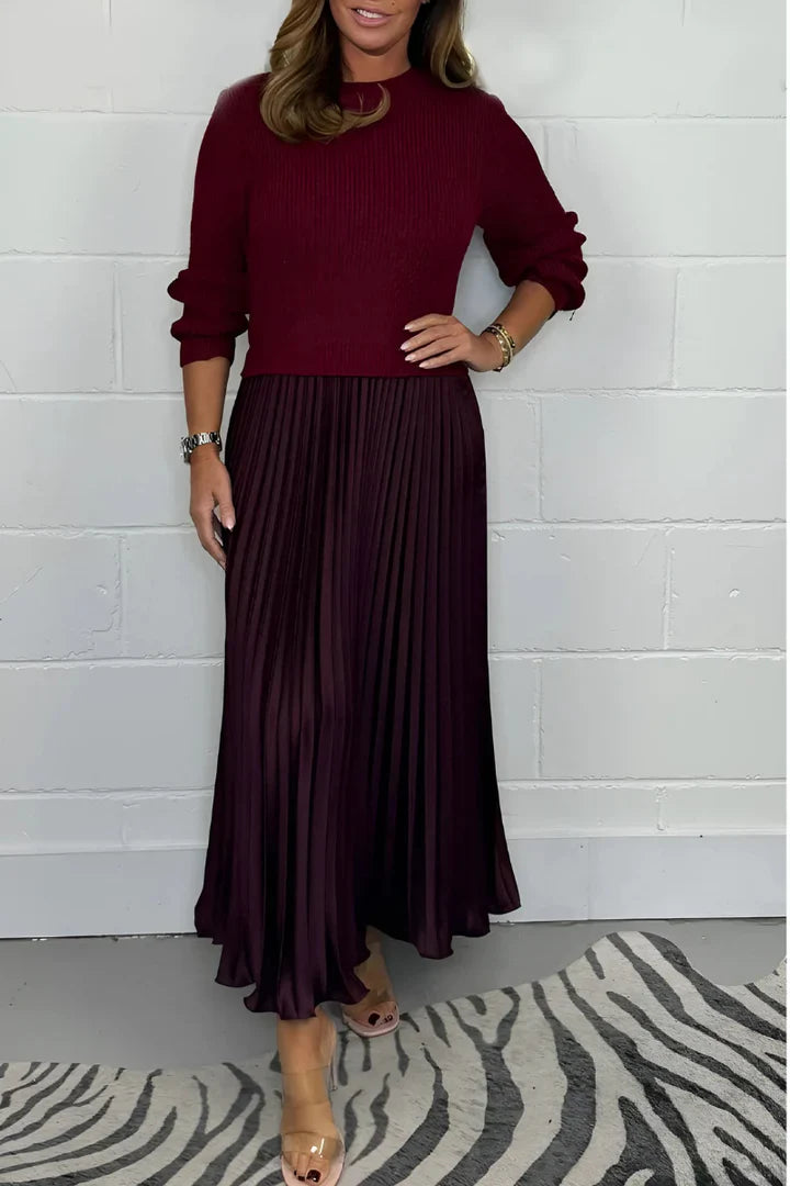 A high-quality women’s dress with a knitted top and a pleated skirt