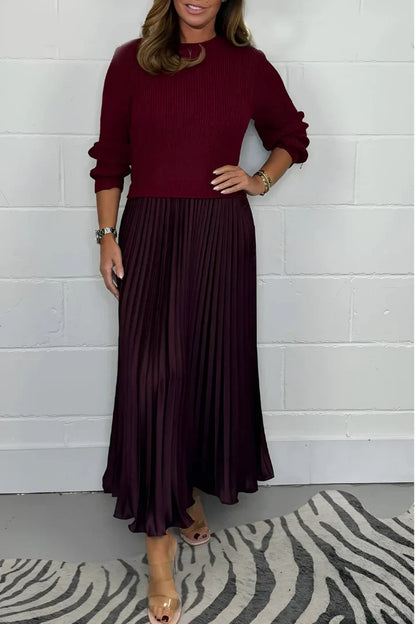 A high-quality women’s dress with a knitted top and a pleated skirt