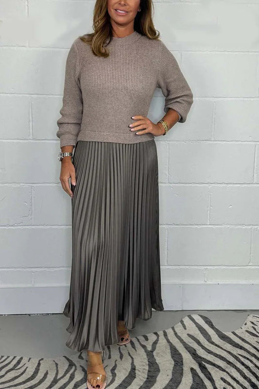 A high-quality women’s dress with a knitted top and a pleated skirt