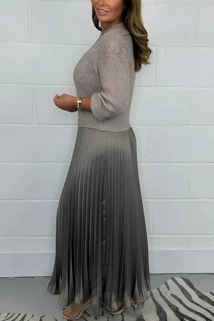 A high-quality women’s dress with a knitted top and a pleated skirt