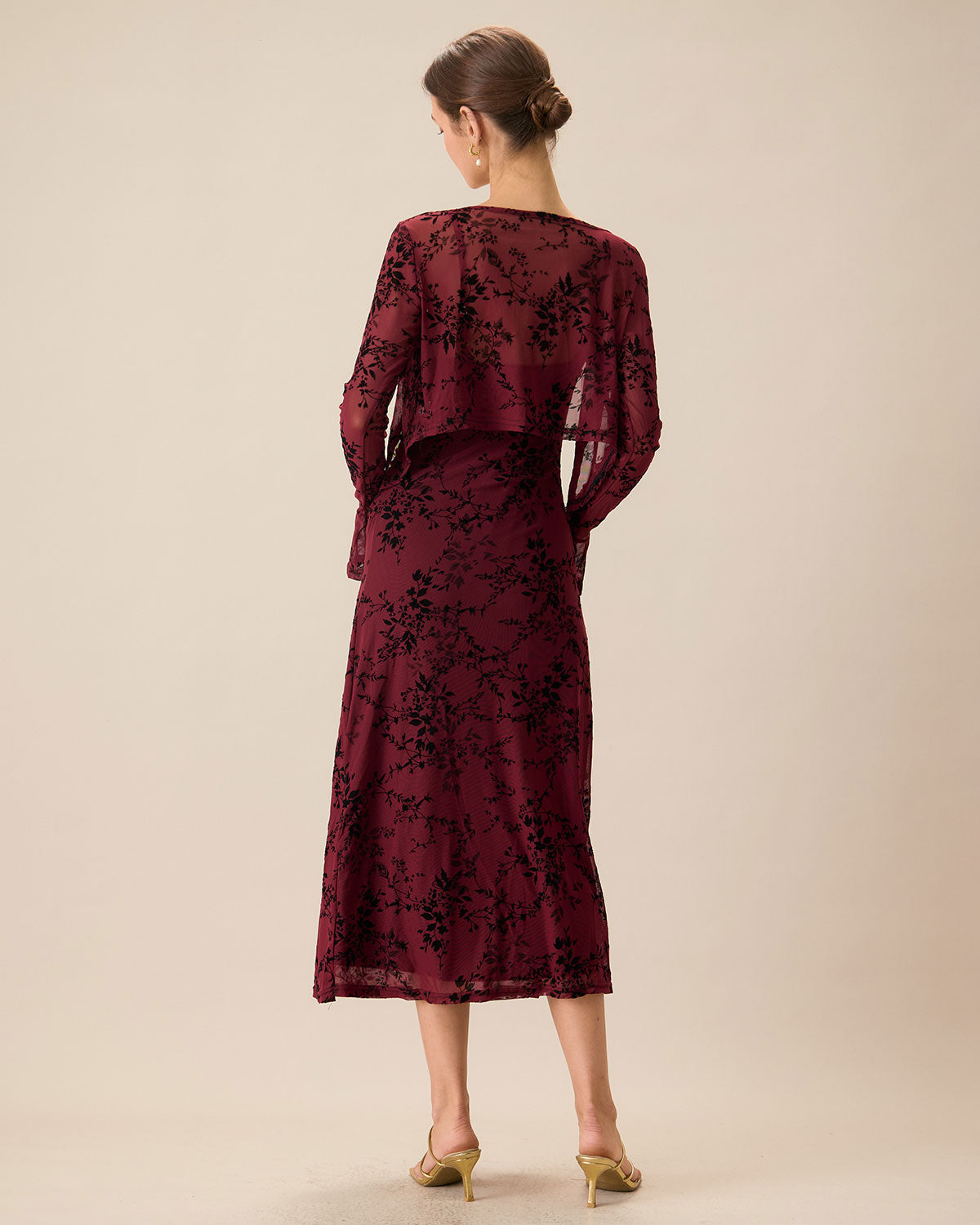 An elegant women’s fitted midi dress with straps and a floral pattern