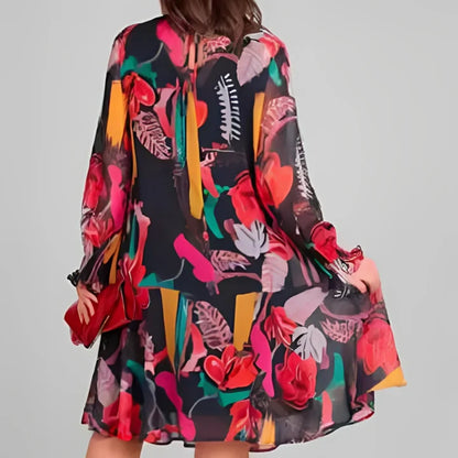 A light, flowy women’s floral dress with long sleeves and a relaxed fit