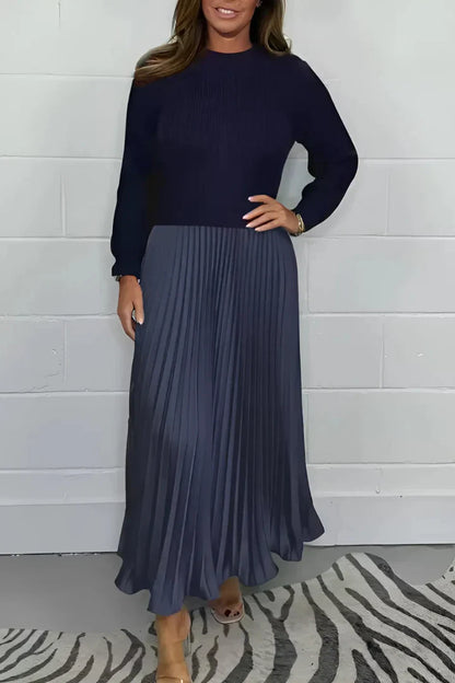 A high-quality women’s dress with a knitted top and a pleated skirt